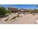 Fully landscaped backyard features a pool, beautiful plants, and rock landscaping at 31453 N Blackfoot Dr, San Tan Valley, AZ 85143