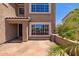 Charming home featuring an inviting entryway with stonework and well-manicured landscaping at 31453 N Blackfoot Dr, San Tan Valley, AZ 85143