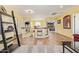 Open hallway with decorative shelving, natural light, and tile flooring upstairs at 31453 N Blackfoot Dr, San Tan Valley, AZ 85143