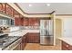 Well-equipped kitchen featuring stainless steel refrigerator and matching appliances at 31453 N Blackfoot Dr, San Tan Valley, AZ 85143