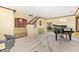 Spacious living room with grand piano, staircase and view into dining area at 31453 N Blackfoot Dr, San Tan Valley, AZ 85143
