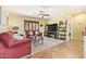 Comfortable living area features neutral carpet, ceiling fan and window with shutters at 31453 N Blackfoot Dr, San Tan Valley, AZ 85143