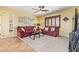 Cozy living room with plush seating, carpet and natural light, creating a welcoming space at 31453 N Blackfoot Dr, San Tan Valley, AZ 85143
