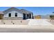Charming single-story home with a well-manicured front yard and a two-car garage in a Gathering-friendly neighborhood at 317 S San Christo Ln, Casa Grande, AZ 85194