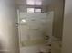 Bathroom showcasing a bathtub with shower, toilet, and sink at 3171 W Orchid Ln, Phoenix, AZ 85051