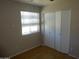 This bedroom includes a closet, window and tile floors at 3171 W Orchid Ln, Phoenix, AZ 85051