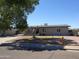 Charming single-story home with a covered carport and a low maintenance rock front yard at 3171 W Orchid Ln, Phoenix, AZ 85051