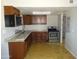 View of a well-lit kitchen equipped with stainless steel appliances and ample cabinet space at 3171 W Orchid Ln, Phoenix, AZ 85051