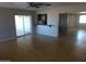 Bright, open-plan space showcases tile floors and seamless flow to the kitchen at 3171 W Orchid Ln, Phoenix, AZ 85051