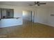 View from living space into kitchen, highlighting seamless flow and neutral walls at 3171 W Orchid Ln, Phoenix, AZ 85051