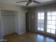 This room features tile floors and a sliding glass door and closet at 3171 W Orchid Ln, Phoenix, AZ 85051