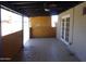 Covered patio with tile flooring and access to the backyard, providing a relaxing outdoor space at 3171 W Orchid Ln, Phoenix, AZ 85051