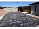 Backyard pool covered for protection viewed with patio and home structure at 3171 W Orchid Ln, Phoenix, AZ 85051