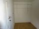 Utility room with shelves, tile floor, and ready for washer and dryer hookups at 3171 W Orchid Ln, Phoenix, AZ 85051