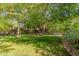 Lush backyard featuring mature trees that provide ample shade at 3274 E Denim Trl, San Tan Valley, AZ 85143