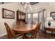 Charming dining room with a large wood table and chairs, perfect for Gathering meals and gatherings at 3274 E Denim Trl, San Tan Valley, AZ 85143