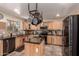 Well-equipped kitchen with granite countertops, a center island and stainless steel appliances at 3274 E Denim Trl, San Tan Valley, AZ 85143