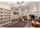 Spacious living room with hardwood floors and multiple workstations at 3274 E Denim Trl, San Tan Valley, AZ 85143