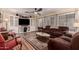Comfortable living room featuring hardwood floors, a ceiling fan, and a large sectional sofa for relaxing at 3274 E Denim Trl, San Tan Valley, AZ 85143