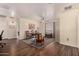 Open concept living room with lots of natural light and hard wood floors at 3274 E Denim Trl, San Tan Valley, AZ 85143