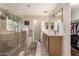 Bright bathroom with a glass enclosed shower, soaking tub, double vanity, and walk-in closet at 3274 E Denim Trl, San Tan Valley, AZ 85143