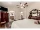 Spacious main bedroom featuring a ceiling fan, ensuite bath and classic furnishings at 3274 E Denim Trl, San Tan Valley, AZ 85143
