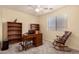 Home office with built-in bookshelves, natural light, and neutral color scheme at 3274 E Denim Trl, San Tan Valley, AZ 85143