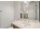 Bright bathroom featuring a sink, mirror, and walk in shower at 3406 E Pyrenees Pass, Phoenix, AZ 85018