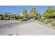 Elegant community entrance with meticulous landscaping offering a warm welcome, enhancing the community's curb appeal at 3406 E Pyrenees Pass, Phoenix, AZ 85018