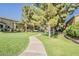 Winding walkway through the landscaped community green space, perfect for leisurely strolls and enjoying the outdoors at 3406 E Pyrenees Pass, Phoenix, AZ 85018