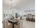Dining Room showcasing modern chandelier and is adjacent to a kitchen with a wine fridge at 3406 E Pyrenees Pass, Phoenix, AZ 85018