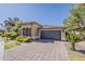 Charming single-story home with a tile roof, stone driveway and a two-car garage at 3406 E Pyrenees Pass, Phoenix, AZ 85018