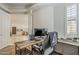 Home office with a view of the kitchen with a large desk and comfortable chair at 3406 E Pyrenees Pass, Phoenix, AZ 85018
