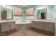 Luxurious bathroom boasting dual vanities, a soaking tub, and attractive wood-look tile flooring at 3946 N 112Th Ave, Avondale, AZ 85392