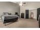 Cozy bedroom featuring modern furnishings and a neutral color palette with carpet at 3946 N 112Th Ave, Avondale, AZ 85392