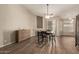 Elegant dining room featuring hardwood floors and contemporary furnishings at 3946 N 112Th Ave, Avondale, AZ 85392
