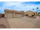 Spacious home featuring a three-car garage, tile roof, neutral paint, and desert landscaping at 3946 N 112Th Ave, Avondale, AZ 85392