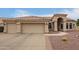 Attractive home featuring a three-car garage, tile roof, neutral paint, and desert landscaping at 3946 N 112Th Ave, Avondale, AZ 85392