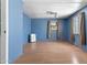 This is a bedroom with blue walls and laminate flooring at 4065 E University Dr # 228, Mesa, AZ 85205