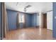 Bright bedroom with wood look floors, a closet and a window for natural light at 4065 E University Dr # 228, Mesa, AZ 85205