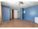 This is a bedroom with blue walls and laminate flooring at 4065 E University Dr # 228, Mesa, AZ 85205