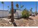 Exterior view of the mobile home showing easy access to utilities, ladder and air conditioner at 4065 E University Dr # 228, Mesa, AZ 85205