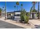 A home with palm trees and cactus out front at 4065 E University Dr # 228, Mesa, AZ 85205
