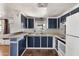 Bright kitchen featuring wood look floors, ample counter space, and lots of cabinetry at 4065 E University Dr # 228, Mesa, AZ 85205