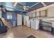 The laundry room contains washer, dryer, refrigerator and access to the backyard through the white painted door at 4065 E University Dr # 228, Mesa, AZ 85205