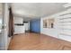 Bright living room featuring wood look floors, an open floor plan, and sliding glass door at 4065 E University Dr # 228, Mesa, AZ 85205