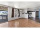 Bright Living Room and Kitchen featuring wood look floors and an open floor plan at 4065 E University Dr # 228, Mesa, AZ 85205