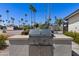 Community outdoor kitchen and barbecue area, great for social gatherings and outdoor cooking at 4065 E University Dr # 228, Mesa, AZ 85205