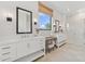 Elegant bathroom with dual vanities, modern fixtures, and a glass-enclosed shower, creating a spa-like experience at 42065 N Cutbow Trl, San Tan Valley, AZ 85140