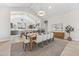 Elegant dining room with open view to kitchen, featuring a wooden table with seating for eight at 42065 N Cutbow Trl, San Tan Valley, AZ 85140